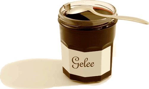 Un pot de confiture avec le support à cuillère